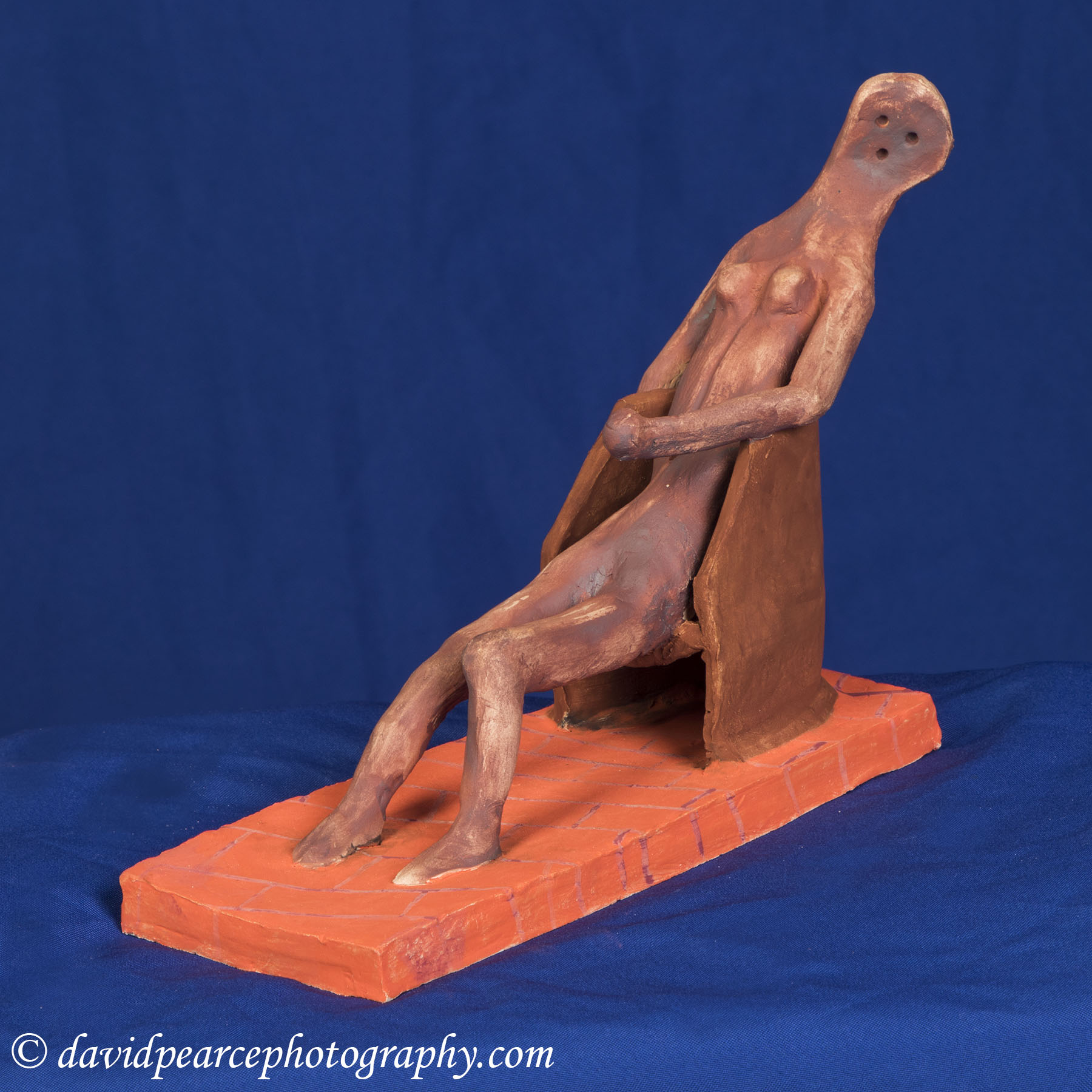Clay Figure in a Chair